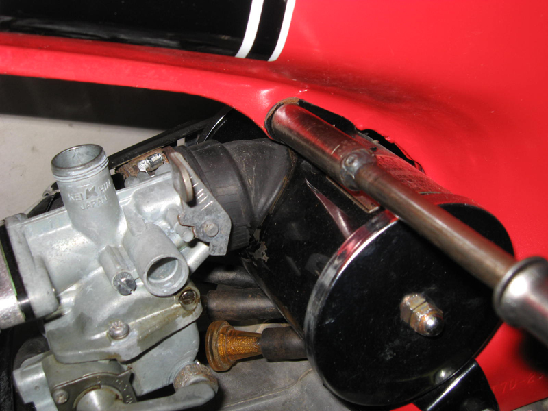 AP loosen 10mm bolt at air filter housing